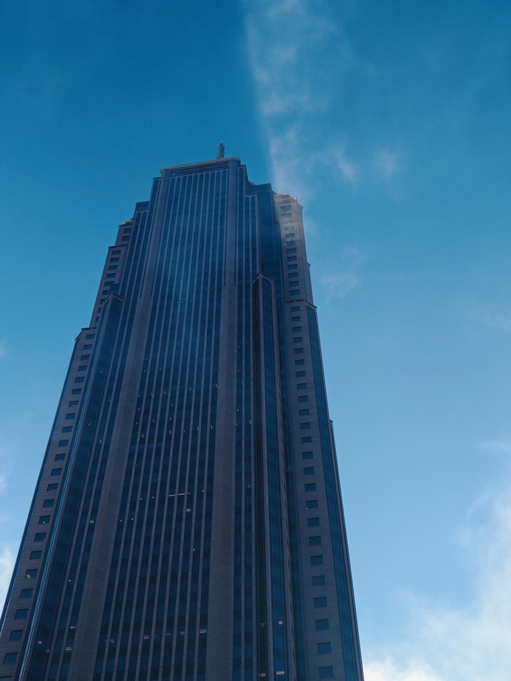 skyscraper against blue sky